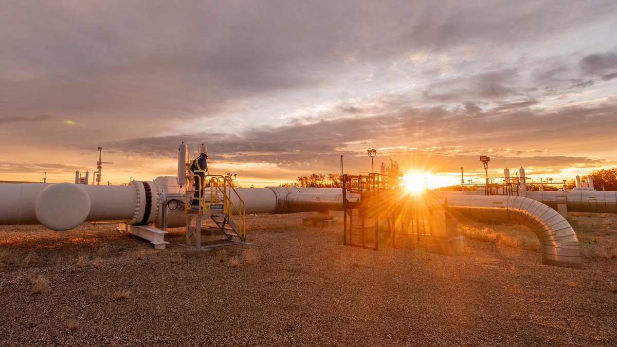 Field operations with sun in background