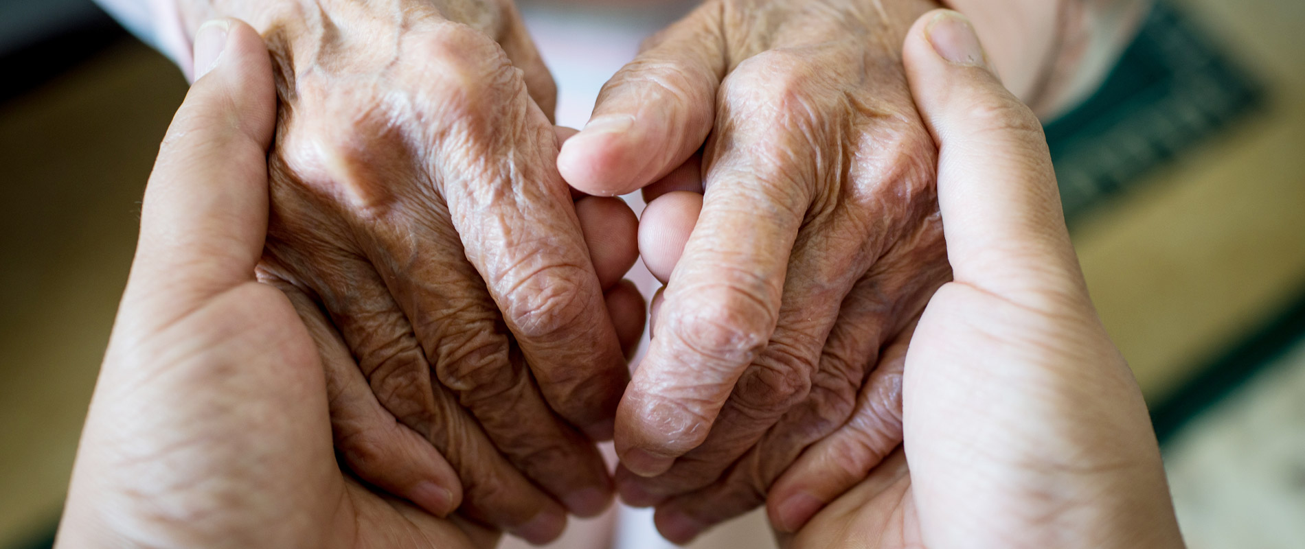 tc-giving-hands-senior-1900x800.jpg